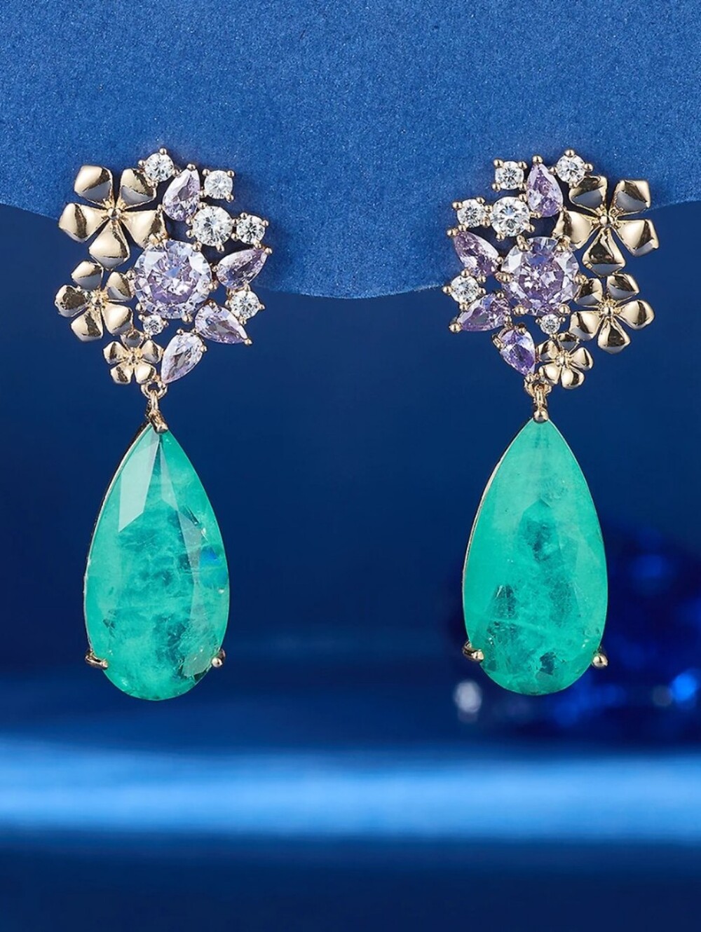 Gold Floral Drop Earrings with Teal Teardrop Stones and Lavender Accents.